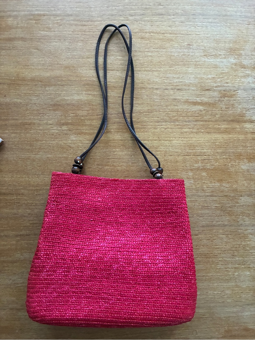 Handwoven Red Straw Shoulder Bag with Wood Bead Accents